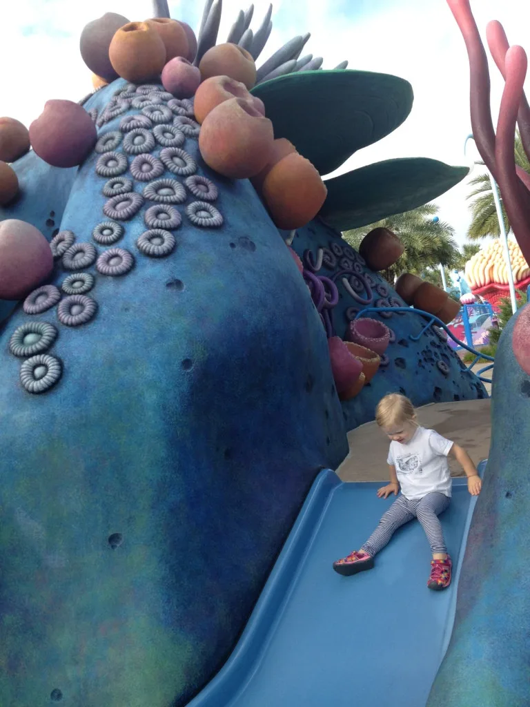 little girl on the playground slide