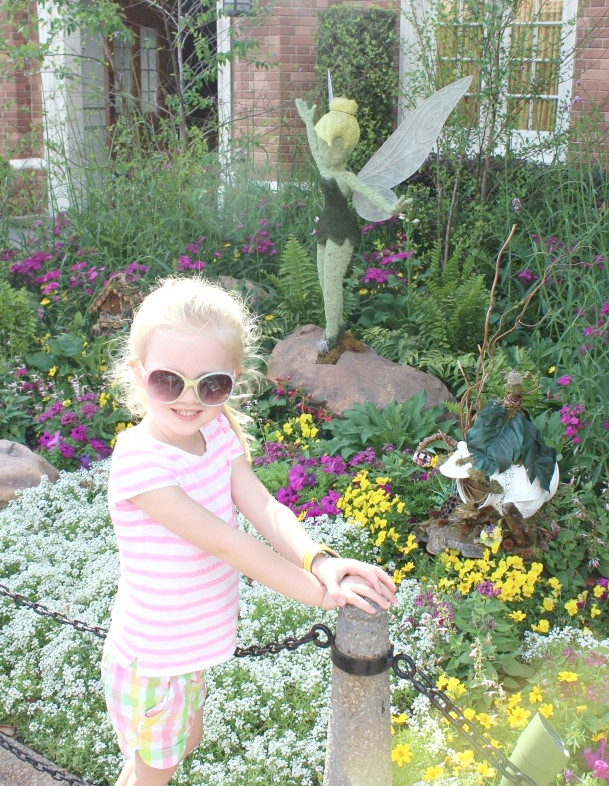 epcot flower and garden festival with kids - girl with tinkerbell topiary