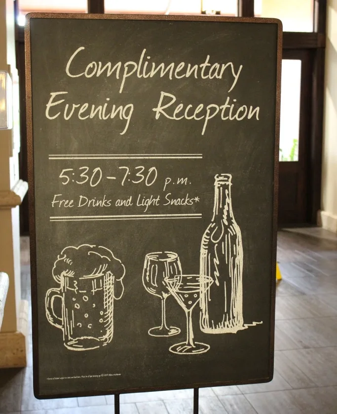 complimentary evening reception sign