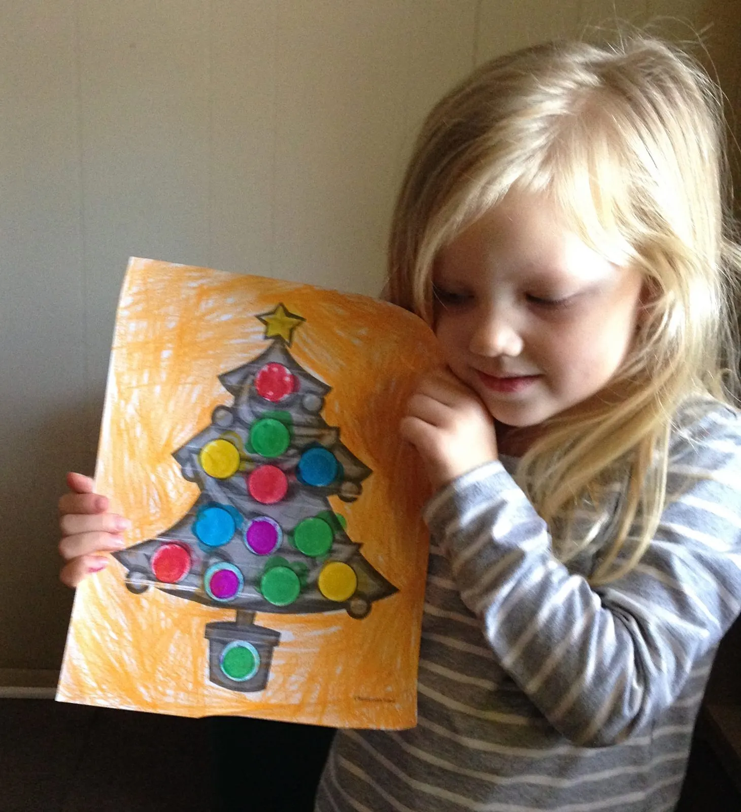 little girl holding a christmas tree coloring page