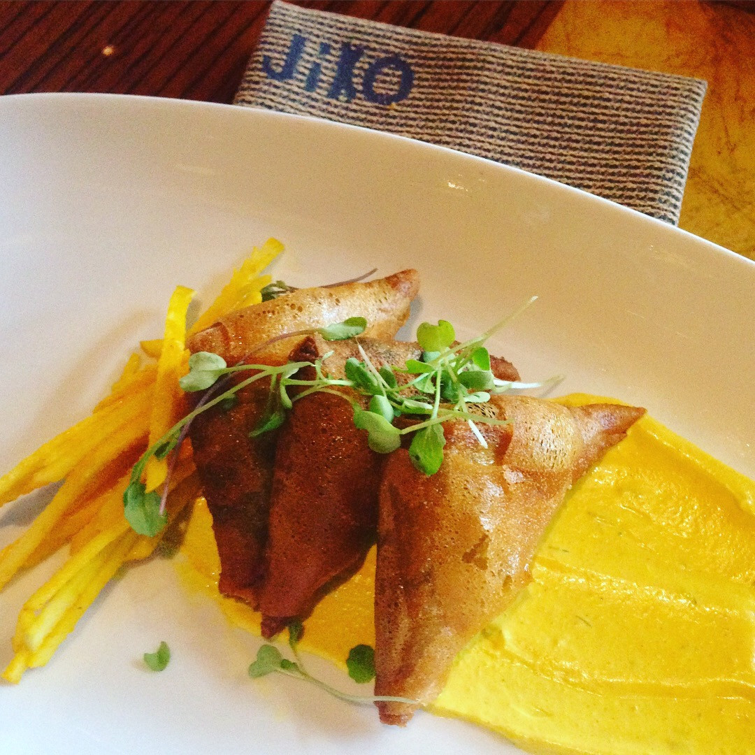 Gourmet food on a white plate at Jiko Restaurant