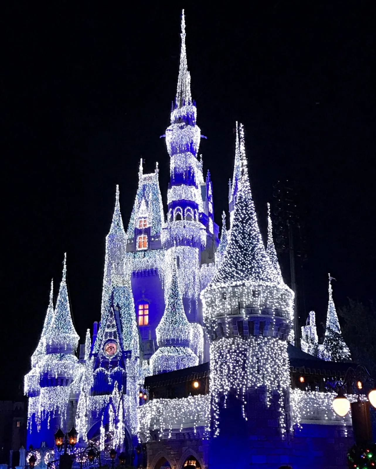 Cinderella's castle with holiday lights - disney world christmas decorations