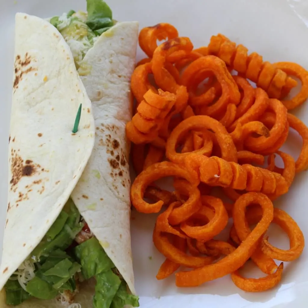 wrap served with sweet potato fries
