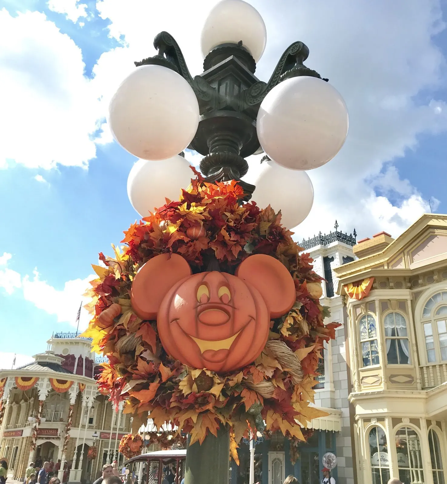 mickey pumpkin wreath on a light pole in magic kingdom
