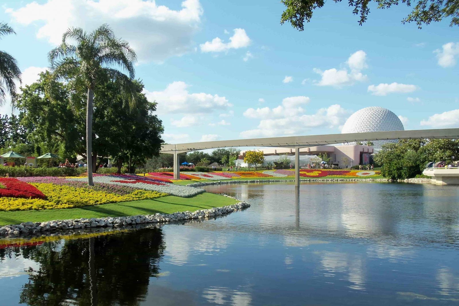Epcot Center flowers, water, monorail and spaceship earth globe