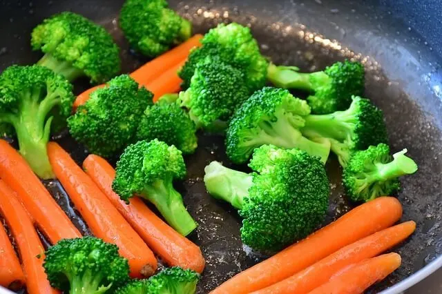 broccoli and carrots in a skillet