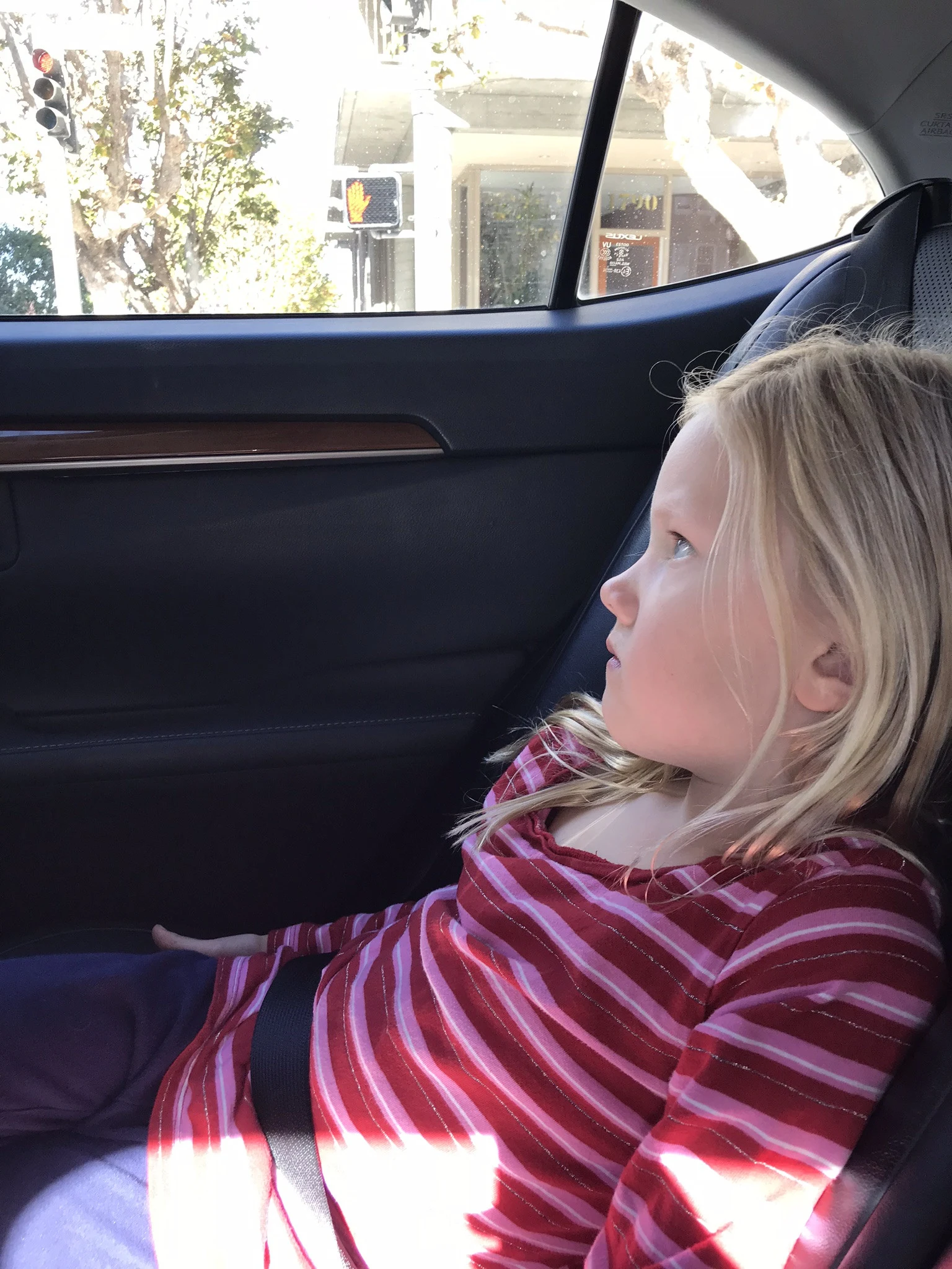 little girl in an uber ride