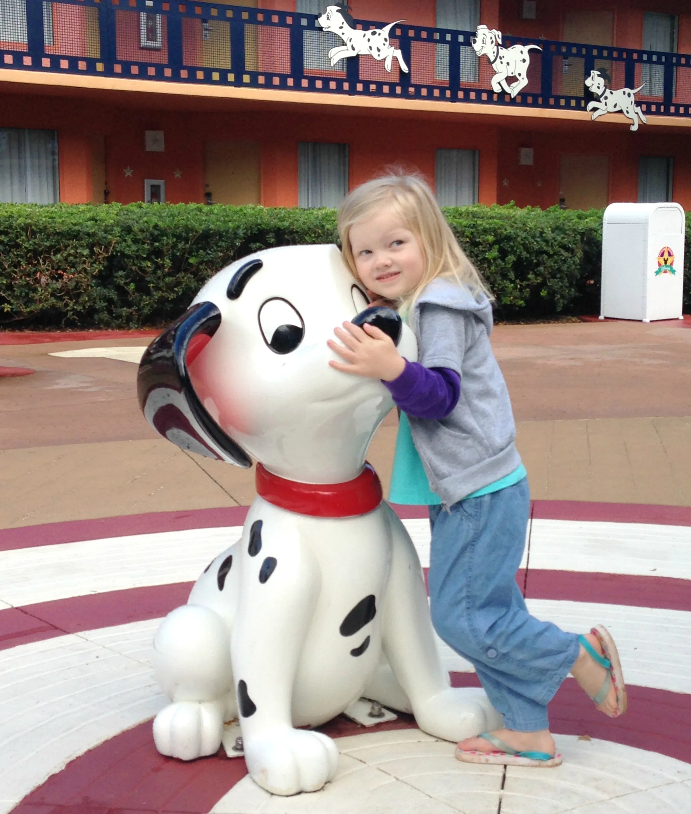 little girl with 101 dalmatians puppy statue