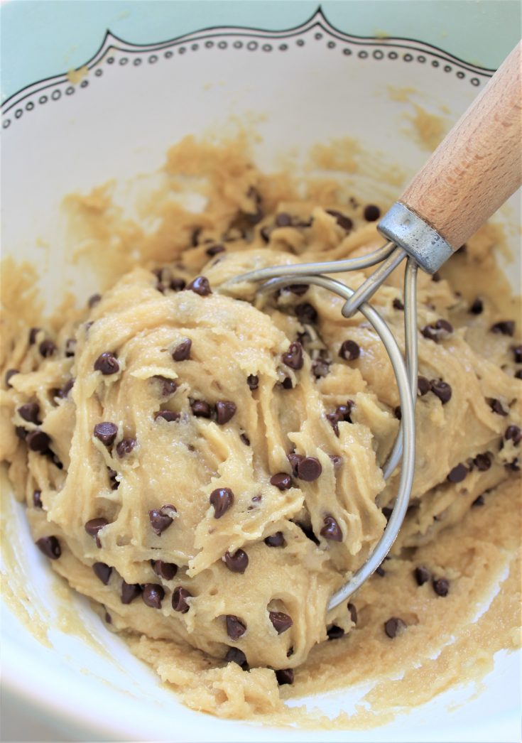 uncooked chocolate chip cookie batter with mixer