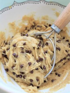 uncooked chocolate chip cookie batter with mixer