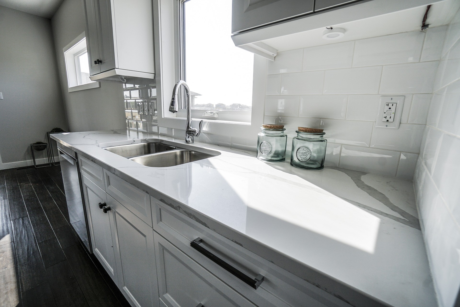 white kitchen with sink and backsplash
