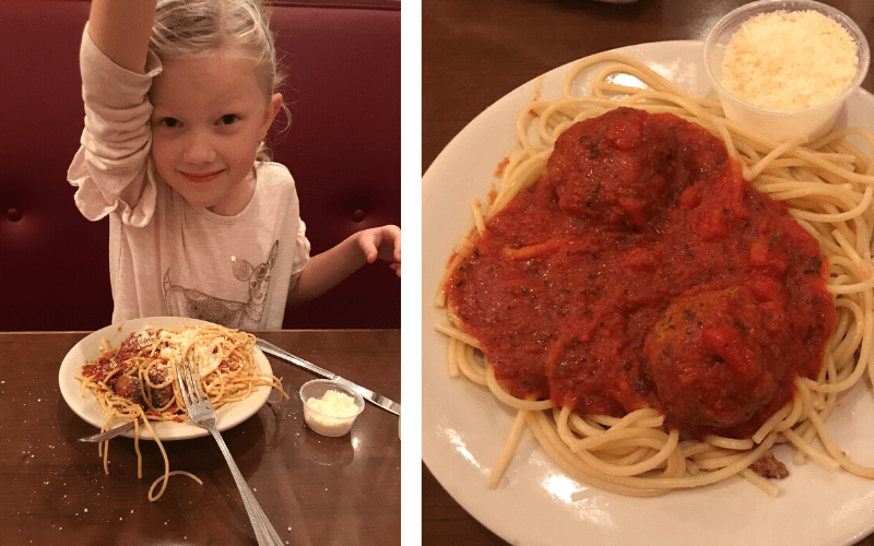 girl eating spaghetti and meatballs