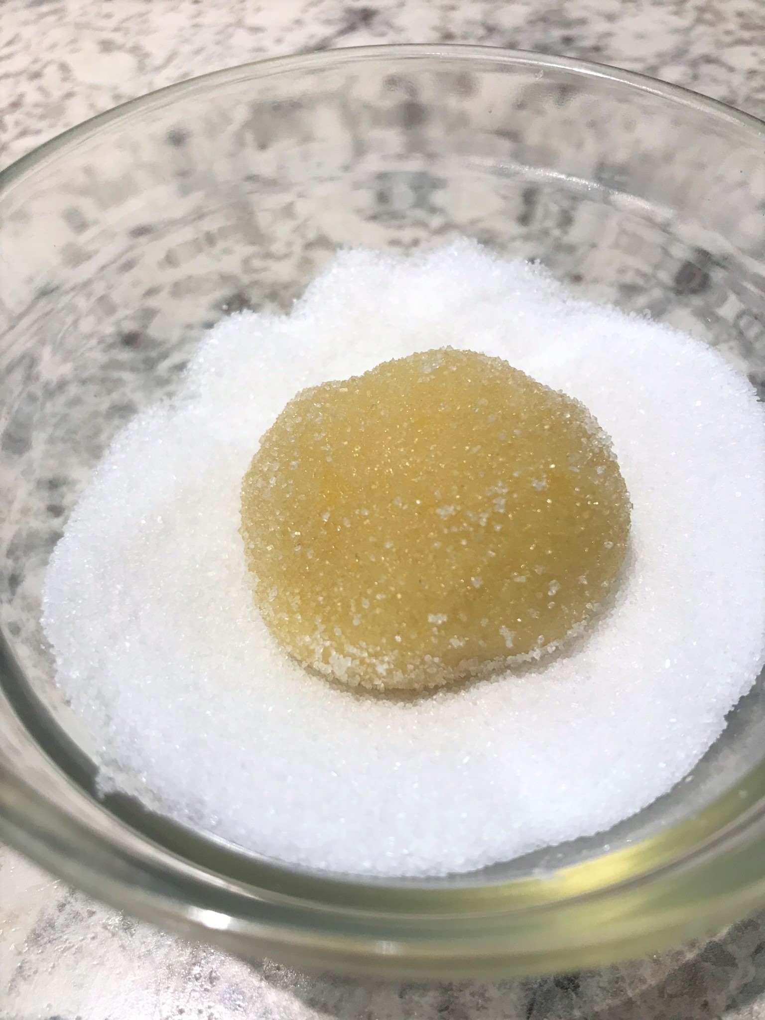 oil sugar cookie without butter dough ball being coated in sugar