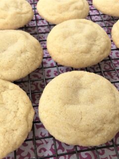 cooked sugar cookies on baking sheet