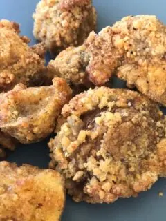 close up picture of cooked air fryer breaded mushrooms