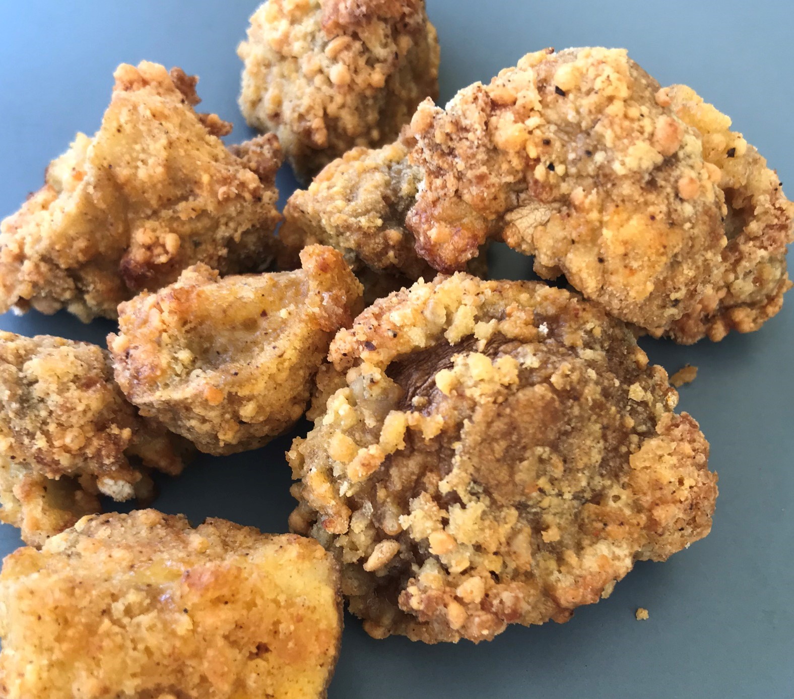 close up picture of cooked air fryer breaded mushrooms