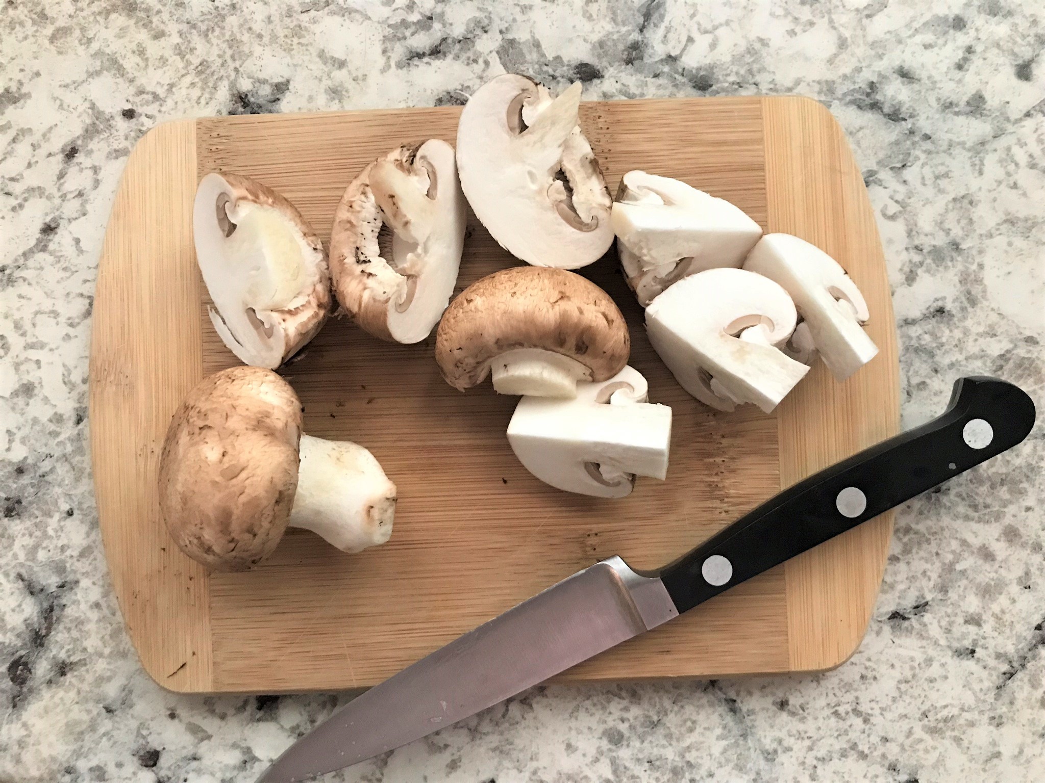 sliced mushrooms on a cutting board
