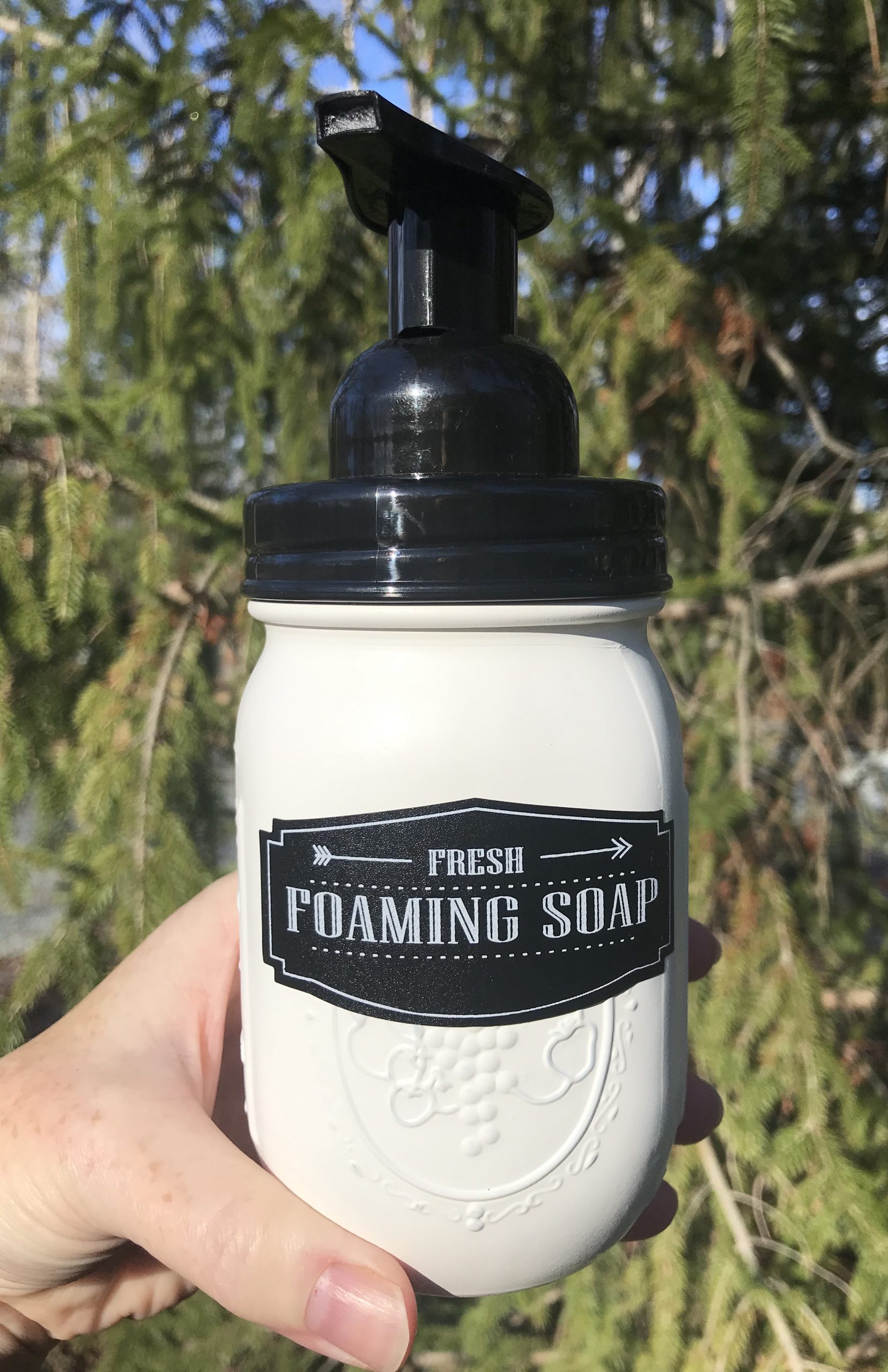 white jar of foaming hand soap with black pump top