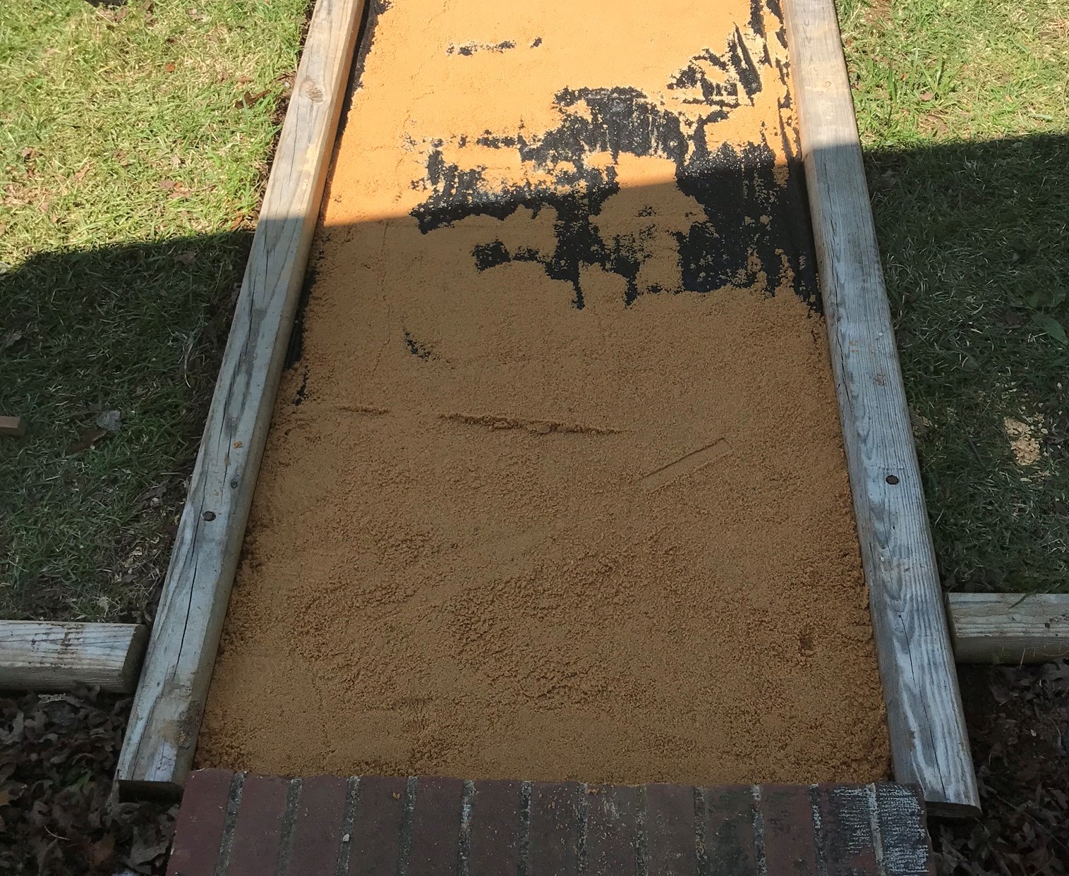leveling sand spread around walkway area