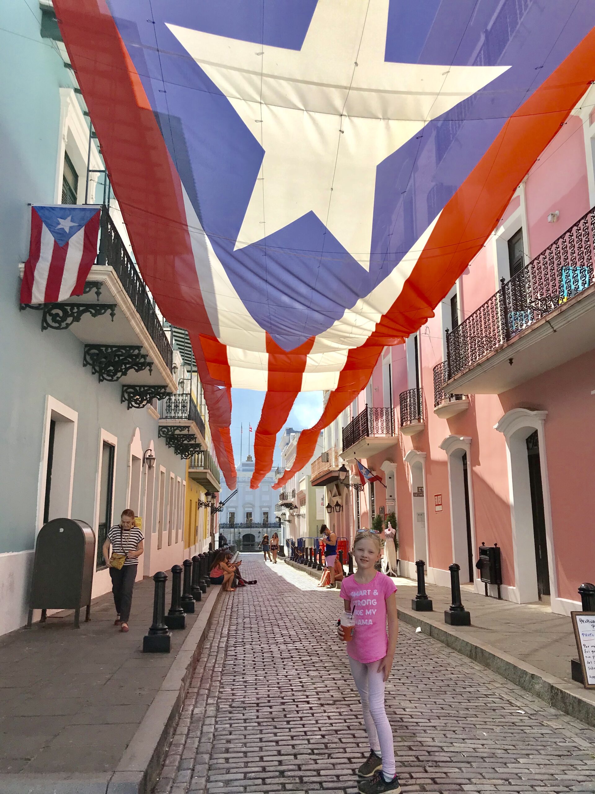 girl under puerto rican flag