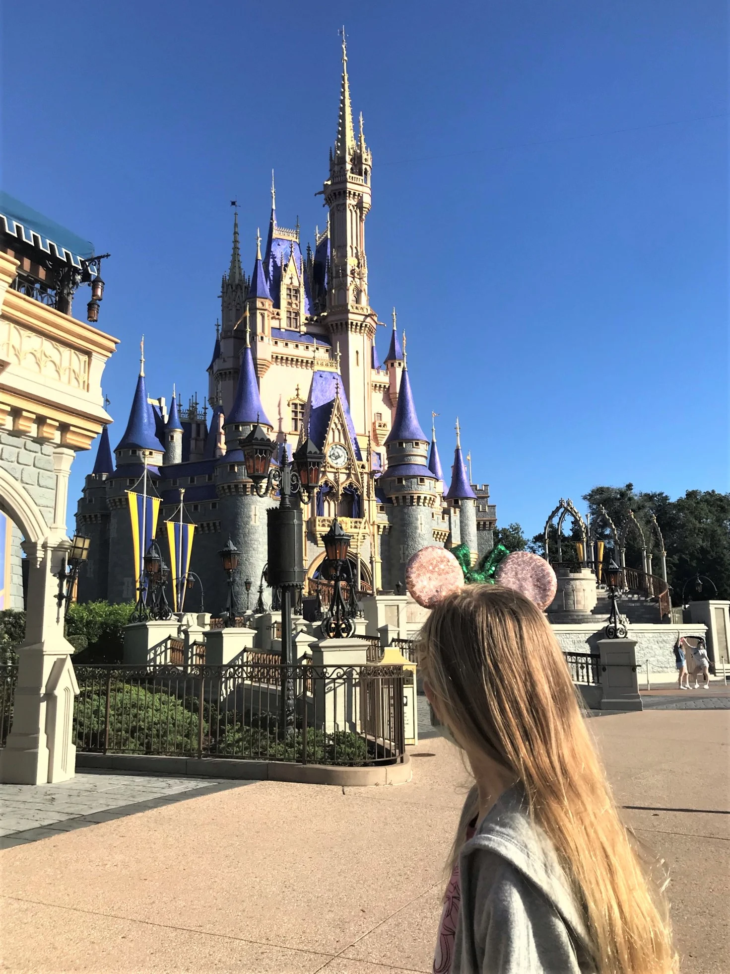 girl in front of cinderella castle