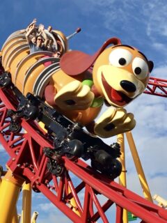 people riding slinky dog dash roller coaster